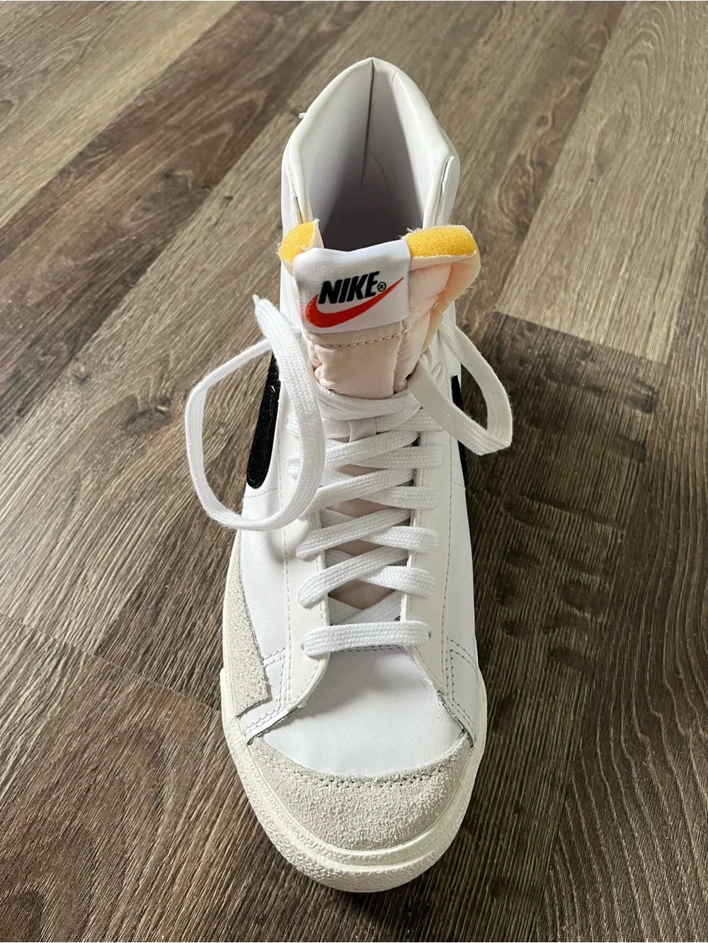 Nike White High-Top Sneaker with Black Swoosh - Picture 2 of 4